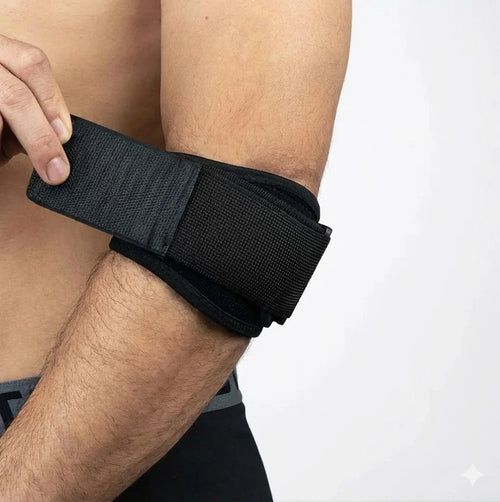 Justerbart stöd för tennisarmbåge med tryckdyna